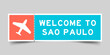 Orange and blue color ticket with plane icon and word welcome to sao paulo on gray background