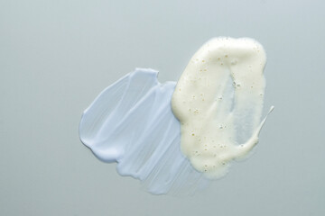 Poster - Assortment of cosmetic mask or cream balm and cleansing foam on gray background. Skin careproducts textures