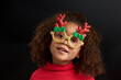© Lisa Tichané - Little girl with afro hair wearing Christmas party glasses