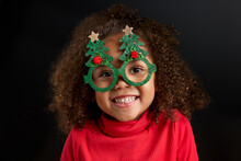 Happy Little Girl Wearing Christmas Party Glasses
