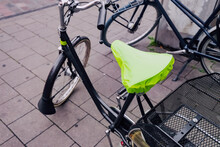 Rain Cover On The Seat Or Saddle Of An Urban Bicycle