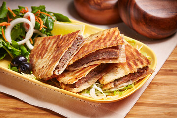 Arayes Meat or Chicken with salad served in dish isolated on table side view of middle east food