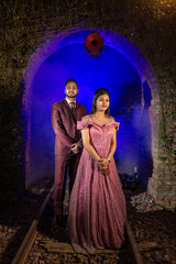 Wall Mural - New Delhi, India - Oct 8 22: A young Indian couple shooting their pre wedding at a famous studio in Delhi India. Romantic couple having shoot Delhi.