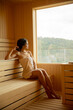 © BGStock72 - Young woman relaxing in the sauna