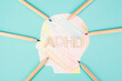 ADHD standing on a colorful head with pencils, attention deficit hyperactivity disorder, mental health
