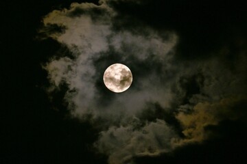 Sticker - A view of the full moon and clouds. Background image of the moon.