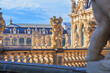 Cityscape - view of a sculptures on the balustrade against the backdrop of the architecture Zwinger Palace complex in Dresden, Germany