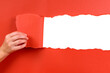 Hand tearing red paper background isolated transparent photo PNG file