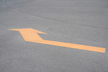 yellow arrow on cement road, construction background