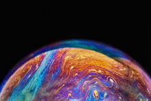 Virtual Reality Space With Abstract Multicolor Psychedelic Planet. Closeup Soap Bubble Like An Alien Planet On Black Background