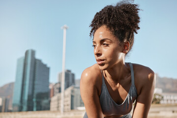 Wall Mural - Fitness, runner and tired black woman in a city sweating from running exercise, cardio workout or training. Breathing, fatigue and sports athlete relaxing or resting on a break on a sunny summers day