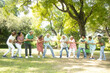 © GAJENDRRA BHATI  - Group Of Senior Indian People Playing Tug War Outdoor In Park. Retirement life.