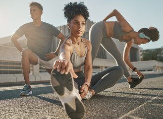 Canvas Print - Fitness, team and friends stretching in city street for exercise run, marathon training run or cardio performance workout. Health commitment, focus and black people warm up while listening to music