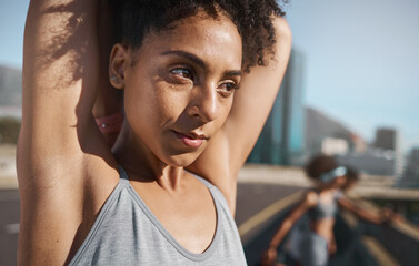 Canvas Print - Fitness, city and woman doing a stretching exercise before an outdoor workout with motivation. Sports, training and healthy lady athlete doing an arm warm up outside in an urban town in Mexico.