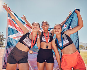 Wall Mural - Athlete, champion and winning group of women holding new Zealand flag and medal after competition, marathon and running at stadium. Portrait of diversity female runners happy about win or achievement