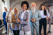 © Mediteraneo - Group of business people with businesswoman leader on foreground