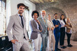 © Mediteraneo - Portrait of successful group of business people at modern office.