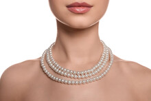 Young Woman With Elegant Pearl Necklace On White Background, Closeup