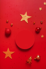 Mock up podium or pedestal for skincare beauty products and Christmas decorations top view on red background