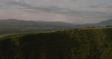 Wall Mural - Lush Green Forested Mountains On A Misty Morning Near Borjomi Nature Reserve In Georgia. aerial pan left