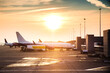 © kikearnaiz - Big airplane in an airport during sunset