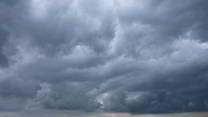 Wall Mural - beautiful stormy sky with white and grey huge clouds. 4k video time lapse of amazing dramatic rainy 