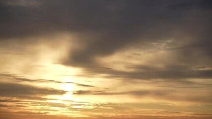Wall Mural - beautiful early morning blue sky with golden clouds. 4k time lapse of peaceful sunny cloudscape. ora