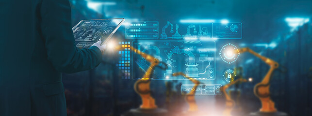 Wall Mural - industry engineer in factory,using smart tablet glass device,control automated robot arm machine lea