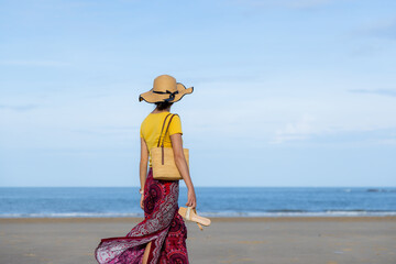 Wall Mural - Travel woman walk on the beach at kinmen of Taiwan