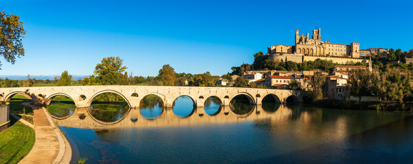 Wall Mural - Old bridge over the Orb river and Saint Nazaire cathedral in Béziers, Hérault, Occitanie, France