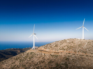 Wall Mural - Scenic view of landscape with wind turbines