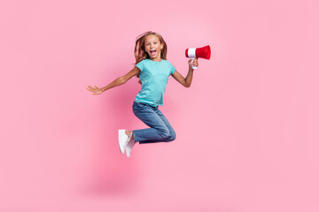 Sticker - Full length photo of cute impressed small kid wear turquoise t-shirt jumping high rising toa isolated pink color background