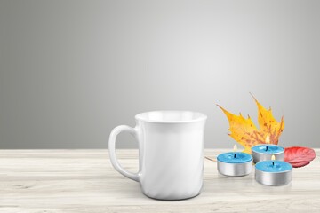 Canvas Print - Hot cup with drink, candels on the desk