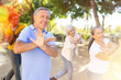 Group of happy multiracial adult people of different age working out outdoor, having fun, spending free time together