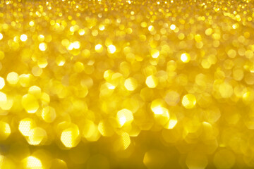 Wall Mural - Abstract golden texture in blurry light for background. Glitter pattern for photo effect and wallpaper