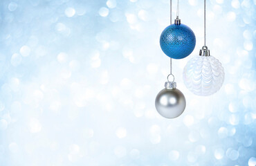 Wall Mural - christmas ornaments on blue background with bokeh closeup