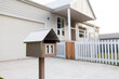 © Austockphoto - Urban mailbox with number 11 in front of new house