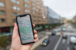 © Johnér - Hand holding smartphone with map app on screen