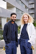 © Johnér - Male and female worker in front of residential building