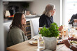 © Johnér - Family eating dinner at home together