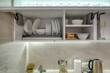 © hiv360 - kitchenware and household utensils on kitchen shelves