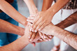 © Emily N/peopleimages.com - Top view, hands and together to connect, for support and solidarity and team building for success, agreement and being community. Hand gesture, group stack pile and connection for loyalty and unity.
