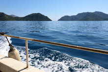 View From The Sailing Boat To Sea With Green Islands. Water Travel And Vacation