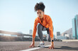 © N F/peopleimages.com - Runner, black woman and street for race, start or sprint in exercise, workout and training in city. Woman, focus and running for fitness, sport and health on road, metro or urban town in sunshine