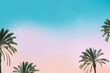 Palm trees on soft blue and pink color sunset sky with space for text. Travel and tropical vacation concept background