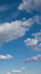 Wall Mural - Beautiful time lapse of clouds flying in blue sky