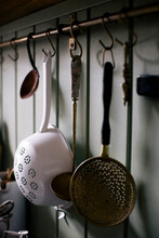 Ladle And Strainers Hanging On Hook