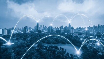 Smart digital city with connection network reciprocity over the cityscape . Concept of future smart wireless digital city and social media networking systems that connects people within the city .