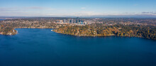Aerial Panoramic Landscape View Across Lake Washington And Meydenbauer Bay To Bellevue Downtown With Its Skyscrapers During Autumn Season - Bird Eye View 