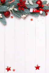 Wall Mural - Christmas composition made from pine tree, stars, festive decorations top view. Christmas flat lay background copy space